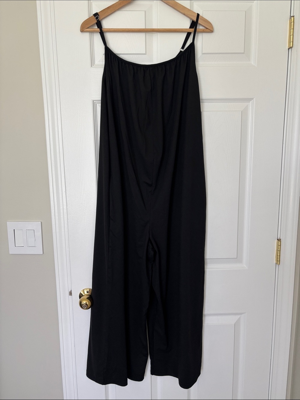 Sleek Black Wide-Leg Jumpsuit with Adjustable Spaghetti Straps